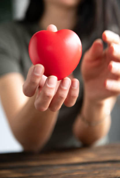 istock The woman is holding a red heart 2157427015