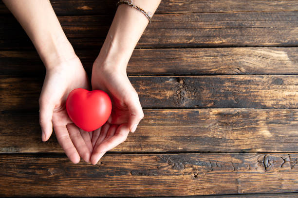 istock The woman is holding a red heart 2157427079