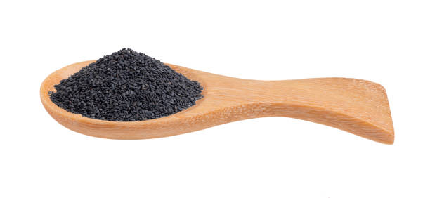 istock Sesame in wood spoon isolated on white background 2157428362