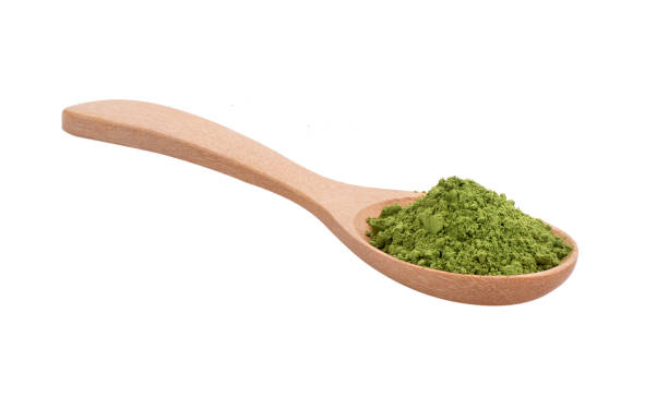 istock matcha green tea powder in wood spoon on white background 2157428419