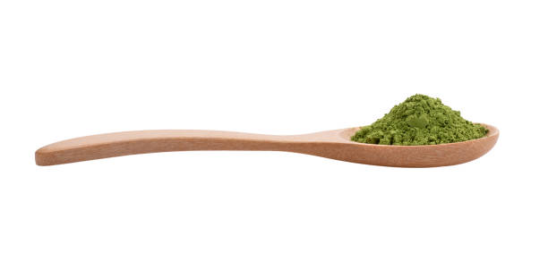 istock matcha green tea powder in wood spoon on white background 2157428531