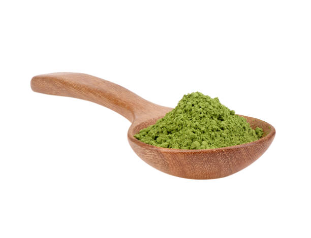 istock matcha green tea powder in wood spoon on white background 2157428616