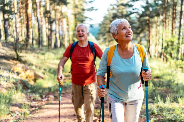 istock Senior hikers enjoying walk in the forest 2157428630