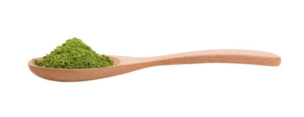istock matcha green tea powder in wood spoon on white background 2157428631