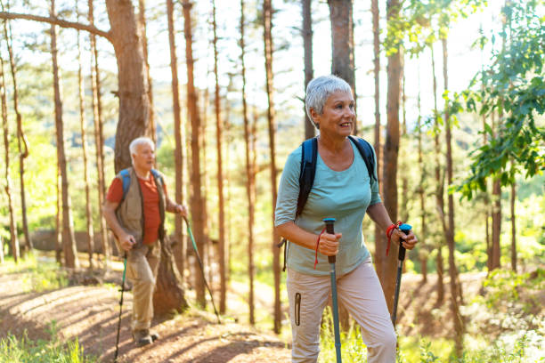 istock Senior hikers enjoying walk in the forest 2157428742