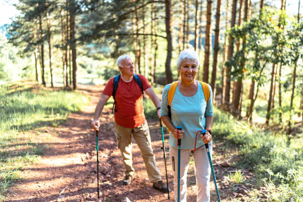 istock Senior hikers enjoying walk in the forest 2157429059