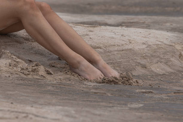 istock Feet in the sand 2157429915