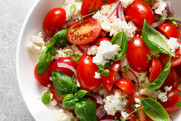istock Salad of tomato, ricotta cheese and basil, top view 2157430071