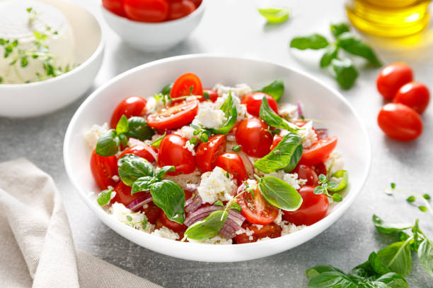 istock Salad of tomato, ricotta cheese and basil 2157430072