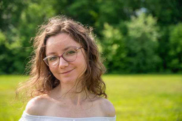 istock Young adult woman looking at camera 2157430842