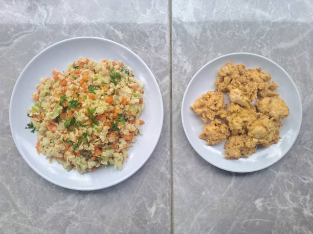 Orak Arik Sayuran Dan Telur Or Scrambled Vegetables And Eggs. Perkedel Tahu Or Mashed Tofu Mixed With Eggs. Serving On A Plate. Food Menu. Top View.