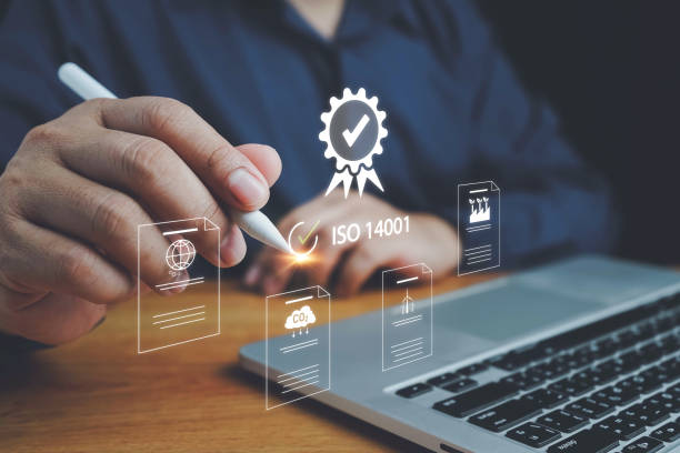 istock ISO 14001 concept. ISO standards quality control 14001 certified for environmental management systems (EMS). Identify, control and reduce the environmental impact of activities. Modern ISO banner. 2157431011