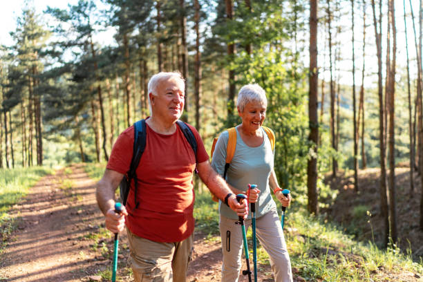 istock Happy senior couple enjoying a walk in the forest. 2157431790