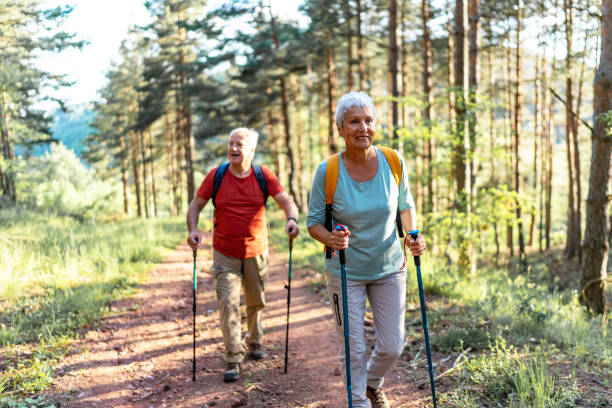 istock Happy senior couple enjoying a walk in the forest. 2157431867