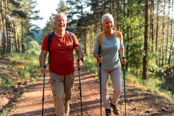 istock Happy senior couple enjoying a walk in the forest. 2157432011