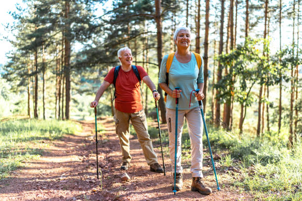istock Happy senior couple enjoying a walk in the forest. 2157432059