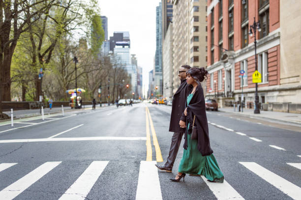istock Elegantly Dressed Couple on Avenue in Manhattan at Dusk 2157433382