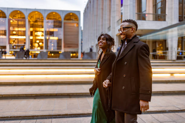 istock Elegantly Dressed Couple Going to Opera at Dusk in Manhattan, NYC 2157433415