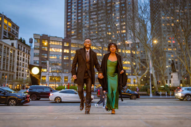 istock Elegantly Dressed Couple Walking to Opera in Manhattan Evening 2157433419