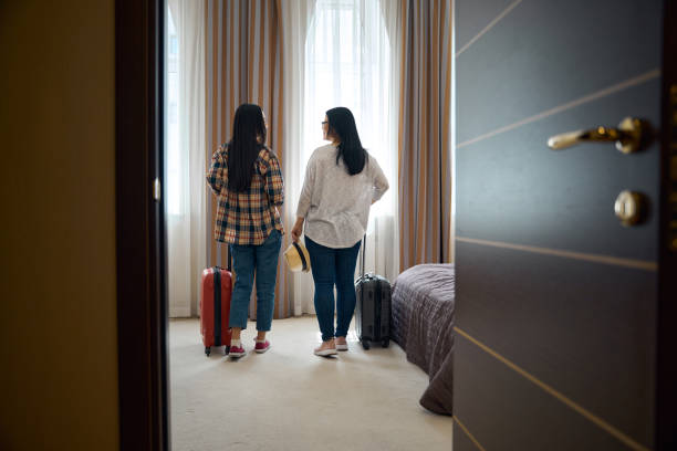 istock Female tourists looking around in their suite upon arrival 2157434489