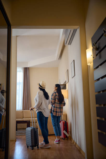 istock Two tourists looking around in their suite on arrival 2157434491