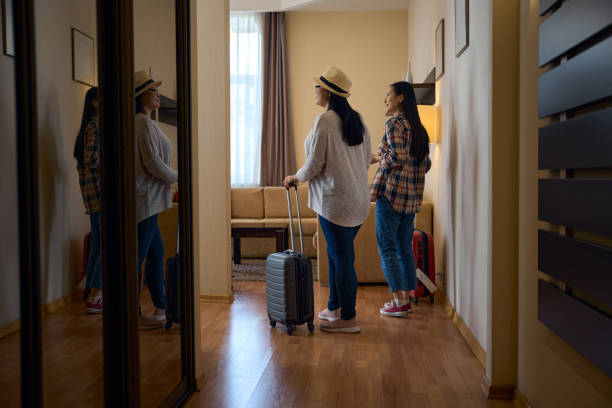 istock Two tourists looking around in their hotel room on arrival 2157434494
