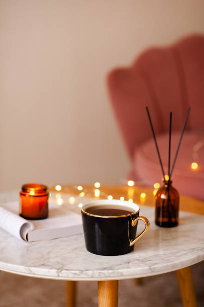 istock Cozy home atmosphere with cup of coffee on table 2157436951