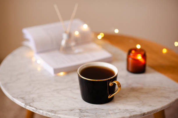istock Cozy home atmosphere with cup of coffee on table 2157436954