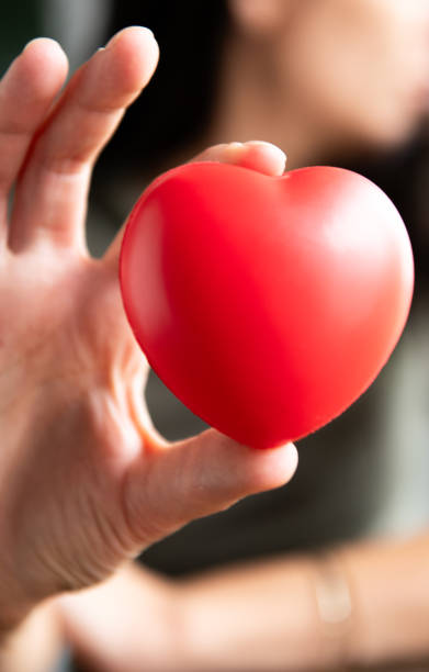 istock The woman is holding a red heart 2157437662