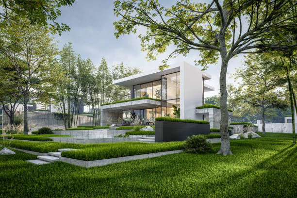 Modern houses with green plant wall and pink cloud in sunrise sky on background. Actual eco architecture