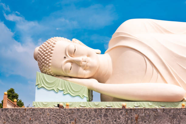 istock Lying Buddha statue in Vietnam with blue sky 2157440769