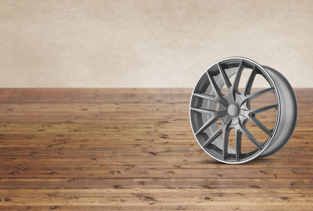 Alloy tire wheel on a wood background