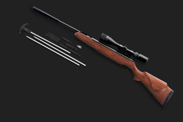 istock Hunting air rifle with rifle cleaning kit on a black background 2157442088
