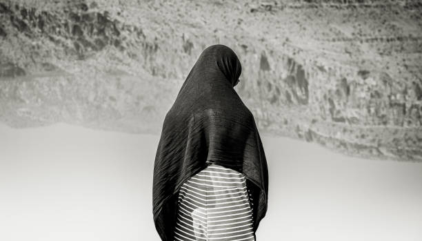 Back view isolated mock up muslim woman wear hijab stand alone isolated by lake alone pose