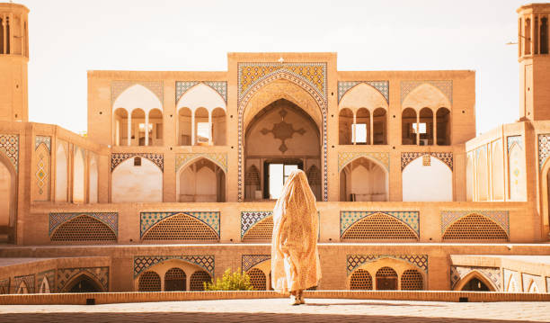 istock Kashan, Iran - 29th may, 2022: Tourists and pilgrims explore sightseeing beautiful Agha Bozorg Mosque 2157444864