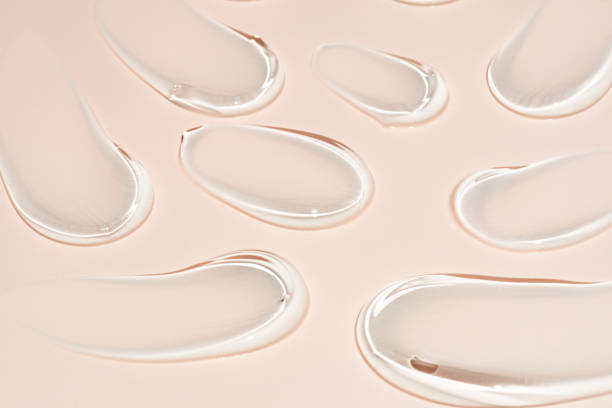 istock cosmetic smears cream gel texture on pastel beige background 2157446947