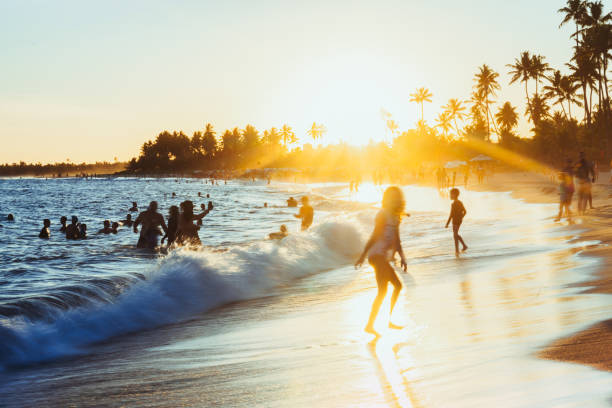 istock people at sunset at Guarajuba beach in Bahia-Brazil 2157447097