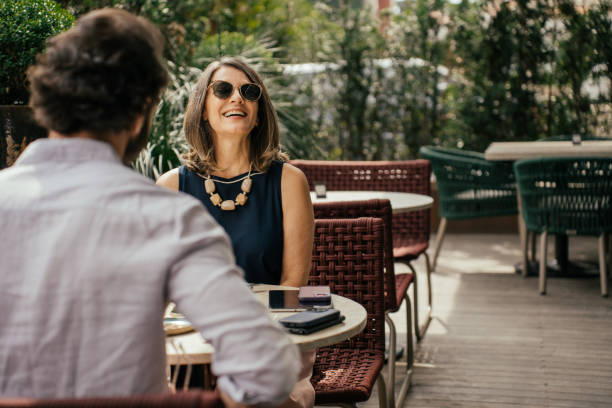 Couple eating outside at luxury hotel Couple eating outside at luxury hotel travel hotel accommodations stock pictures, royalty-free photos & images