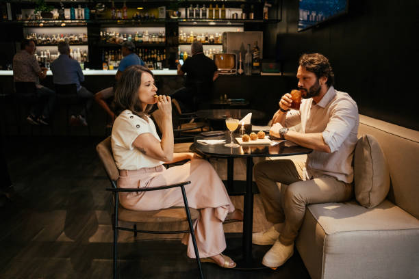 istock Couple having happy hour at luxury hotel 2157447509