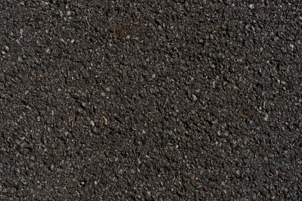 istock Close-up of textured asphalt road surface 2157453712