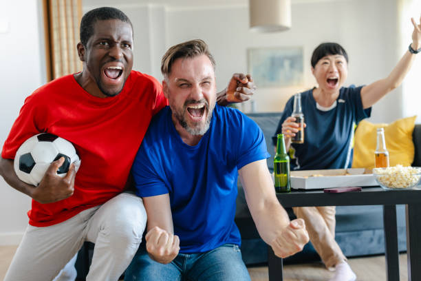 istock Sports fans enthusiastically support their team 2157455742