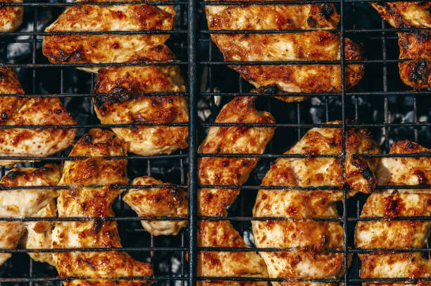istock Fresh chicken meat is gradually fried on grill, emitting unique smell that arouses appetite. 2157455978