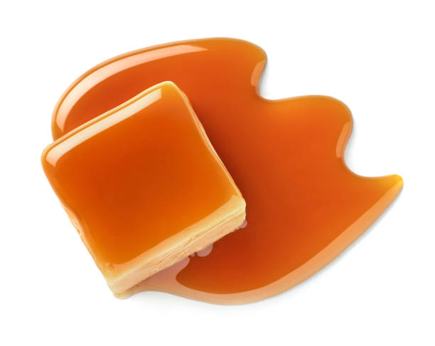 istock One sweet caramel candy cube topped with caramel sauce on white background 2157456551