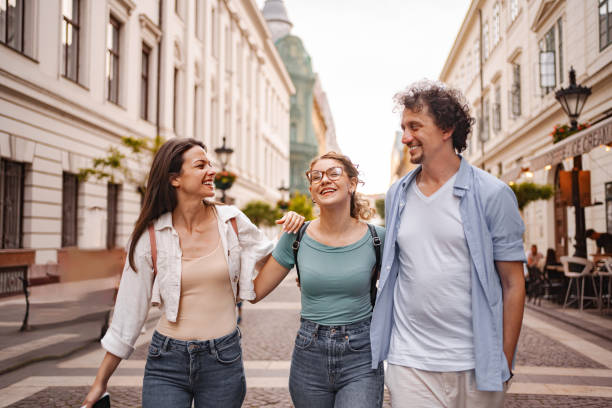 istock Three smiling tourists exploring the city of Budapest 2157457968