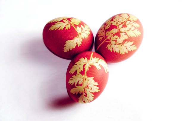 istock Decorated eggs with intricate yellow designs, isolated. 2157467770