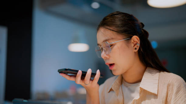 istock Asian woman using smart AI virtual assistant on her smartphone. 2157469733