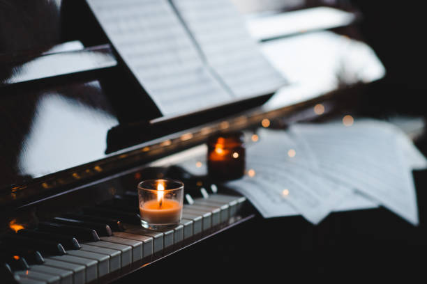 Piano keys with musical notes close up