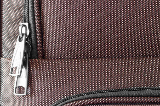 texture of a travel bag, fabric with locks and patterns, used as a background