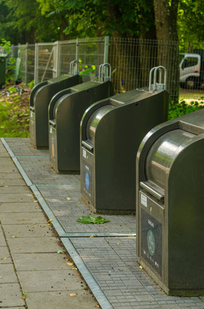 istock Vilnius, Lithuania, June 11, 2024. Modern underground garbage containers for separate collection of garbage in park. 2157472178