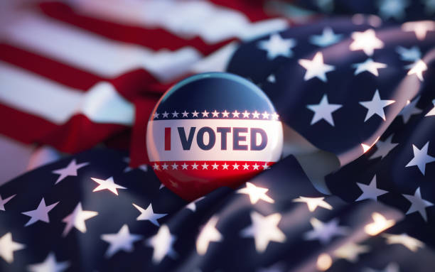 istock I Voted Printed Badge On Over American Flag 2157473222